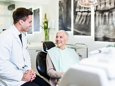 Older female patient talking with her dentist?