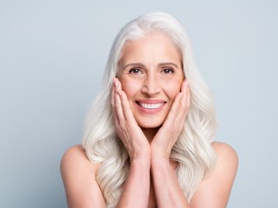 Dentist showing a dental implant model to a patient