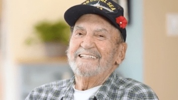 Smiling older man in black baseball cap