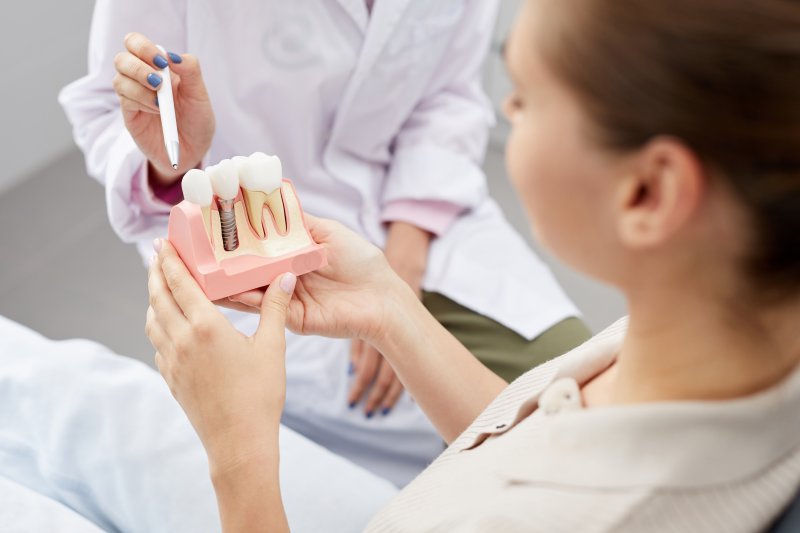 woman undergoing dental implant consultation